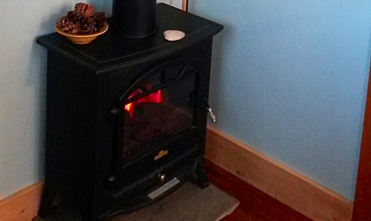 Electric wood stove adds cozy and homey atmosphere 